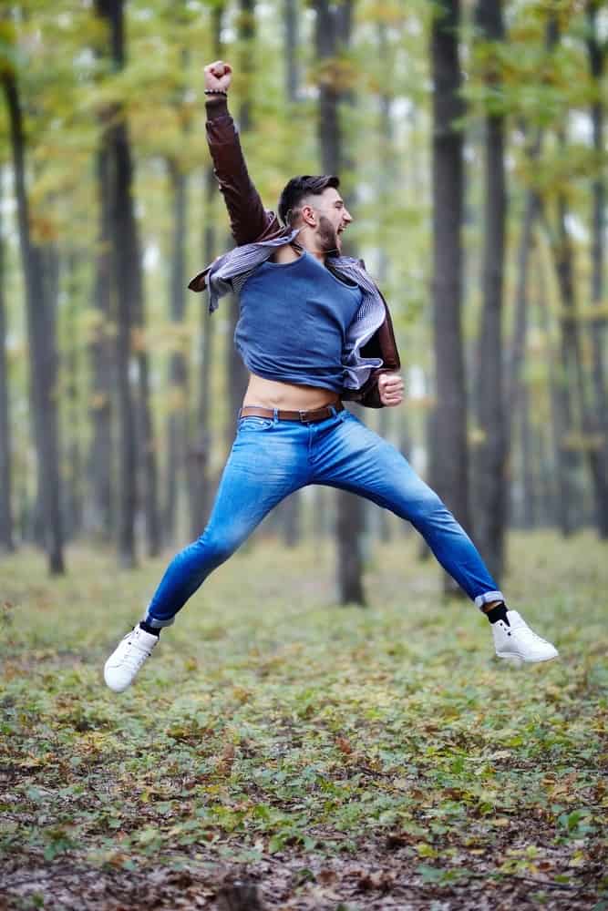 Young man jumping for joy